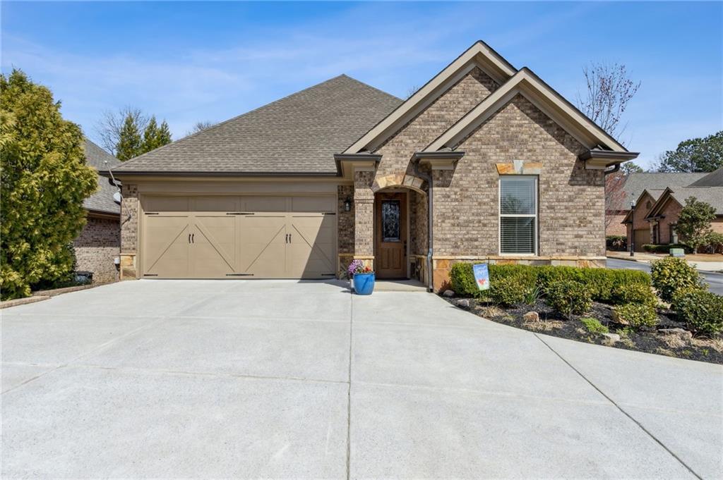 1358 Magnolia Path Way Sugar Hill, GA 30518 - Photo 1 of 1 a front view of a house with a yard and garage