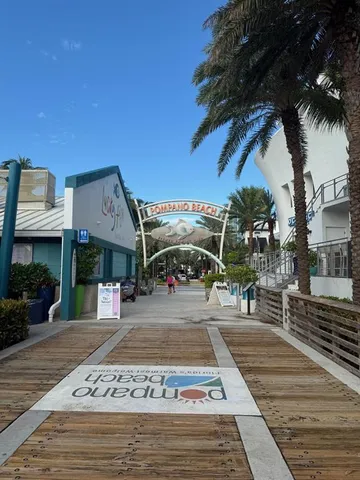 a view of a swimming pool and car parked
