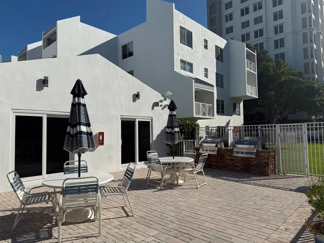 a building outdoor space with patio furniture