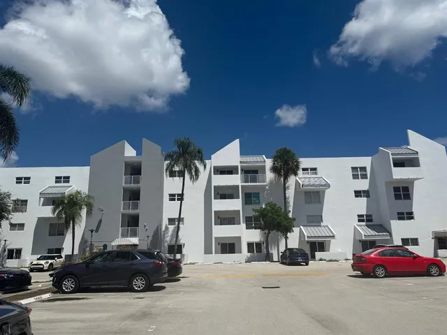 a view of a town with palm trees