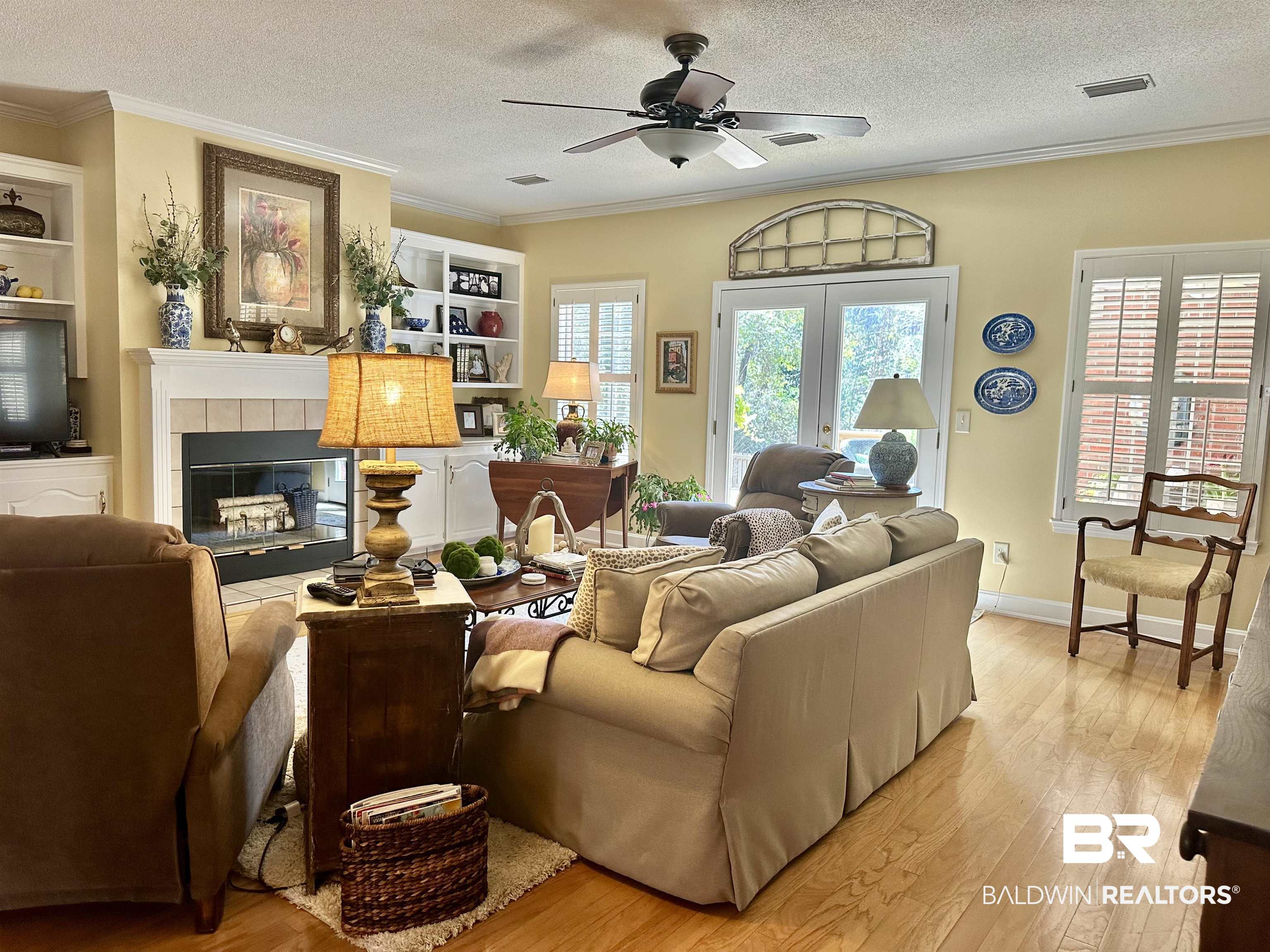 148 Brooks Boulevard Brewton, AL 36426 - Photo 6 of 45 Living room featuring visible vents, light wood-style flooring, a healthy amount of sunlight, and ceiling fan