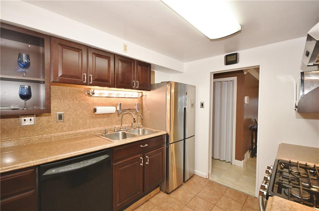 413 Grove Road Verona, PA 15147 - Photo 5 of 25 Sleek appliances, more counter space, and plenty of cabinets!