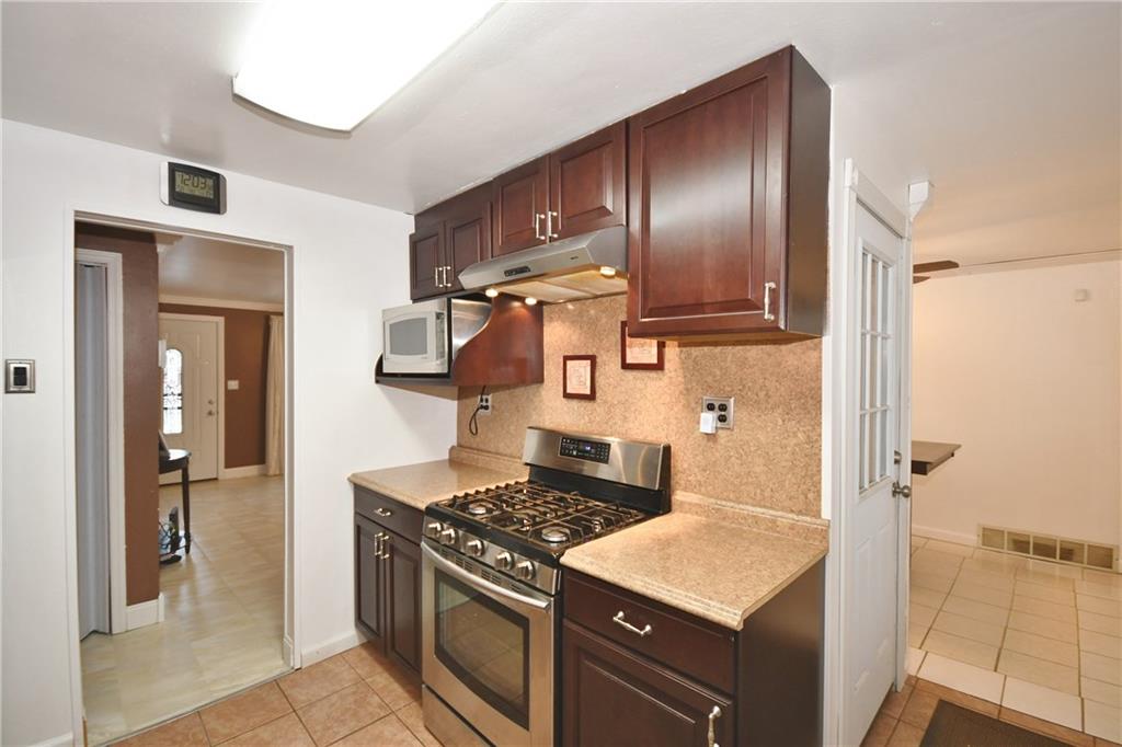 413 Grove Road Verona, PA 15147 - Photo 8 of 25 Kitchen can be accessed from living room and dining room.