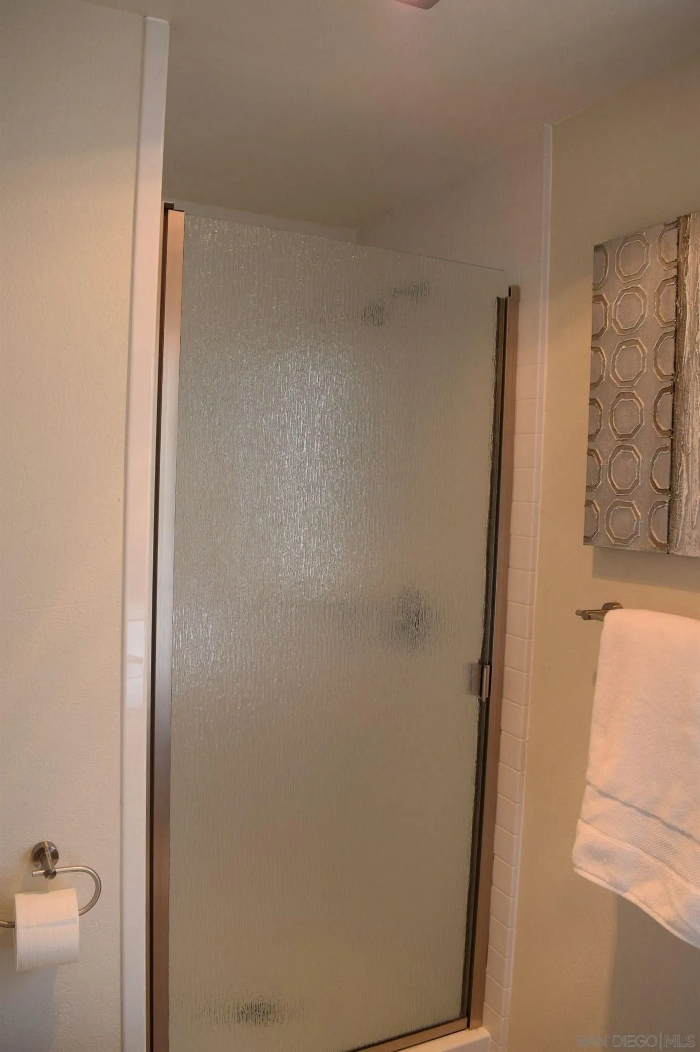 70 Trinidad Bend Coronado, CA 92118 - Photo 11 of 44 a bathroom with a granite countertop shower and a sink
