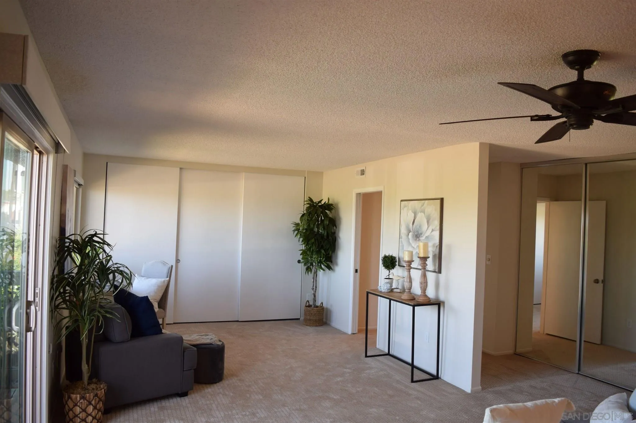 70 Trinidad Bend Coronado, CA 92118 - Photo 23 of 44 a living room with furniture and a potted plant