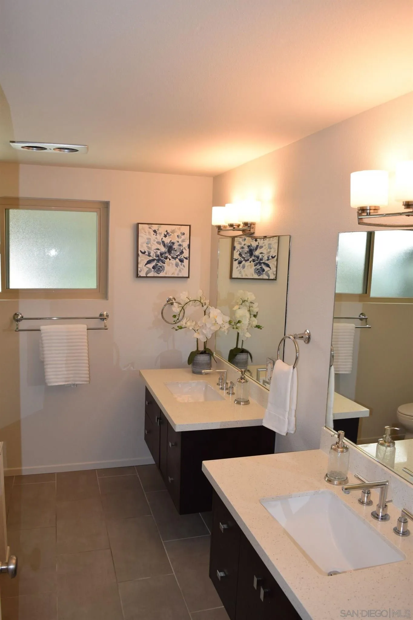 70 Trinidad Bend Coronado, CA 92118 - Photo 27 of 44 a bathroom with a sink vanity and mirror