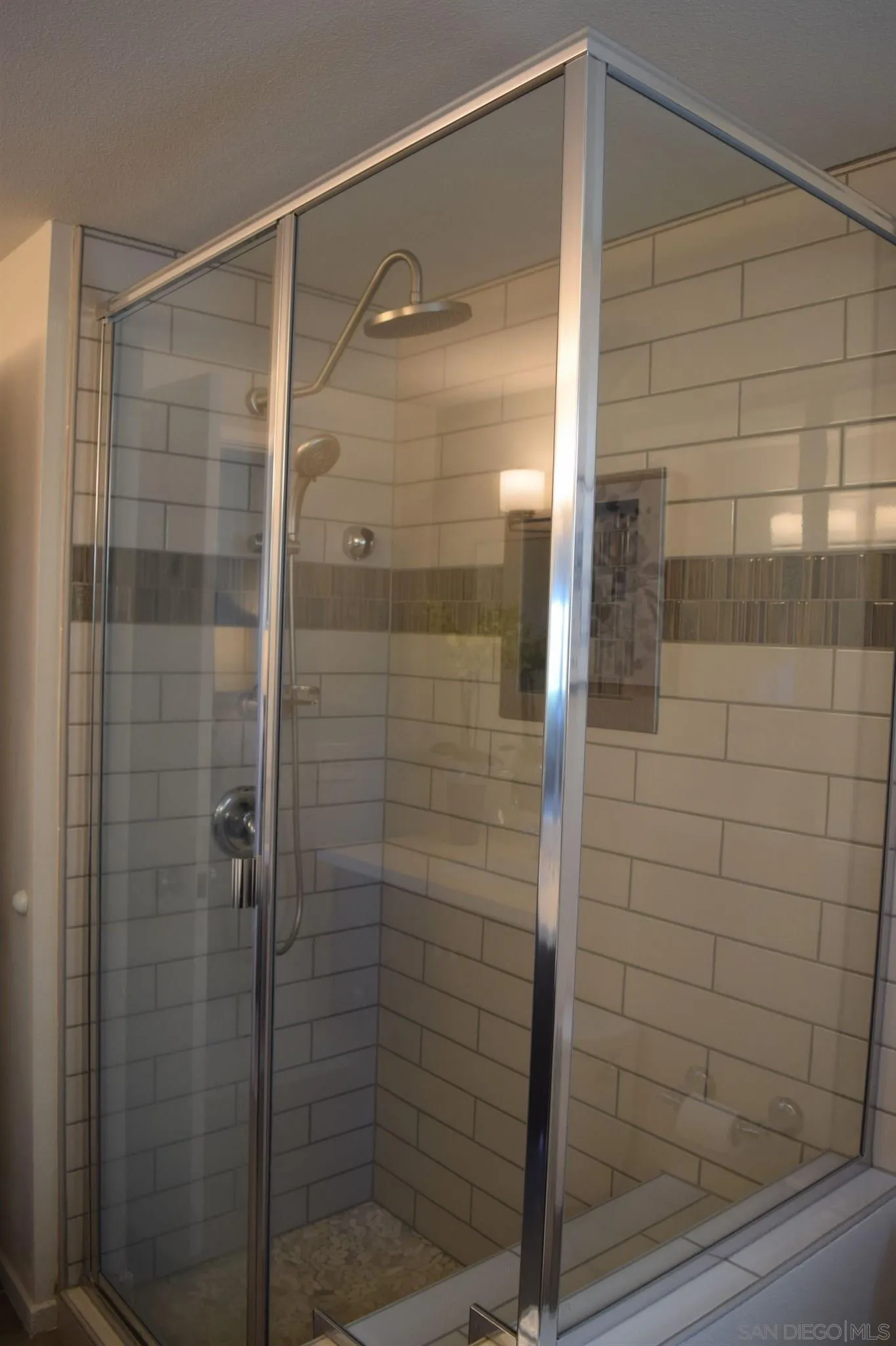70 Trinidad Bend Coronado, CA 92118 - Photo 29 of 44 a bathroom with a glass shower door