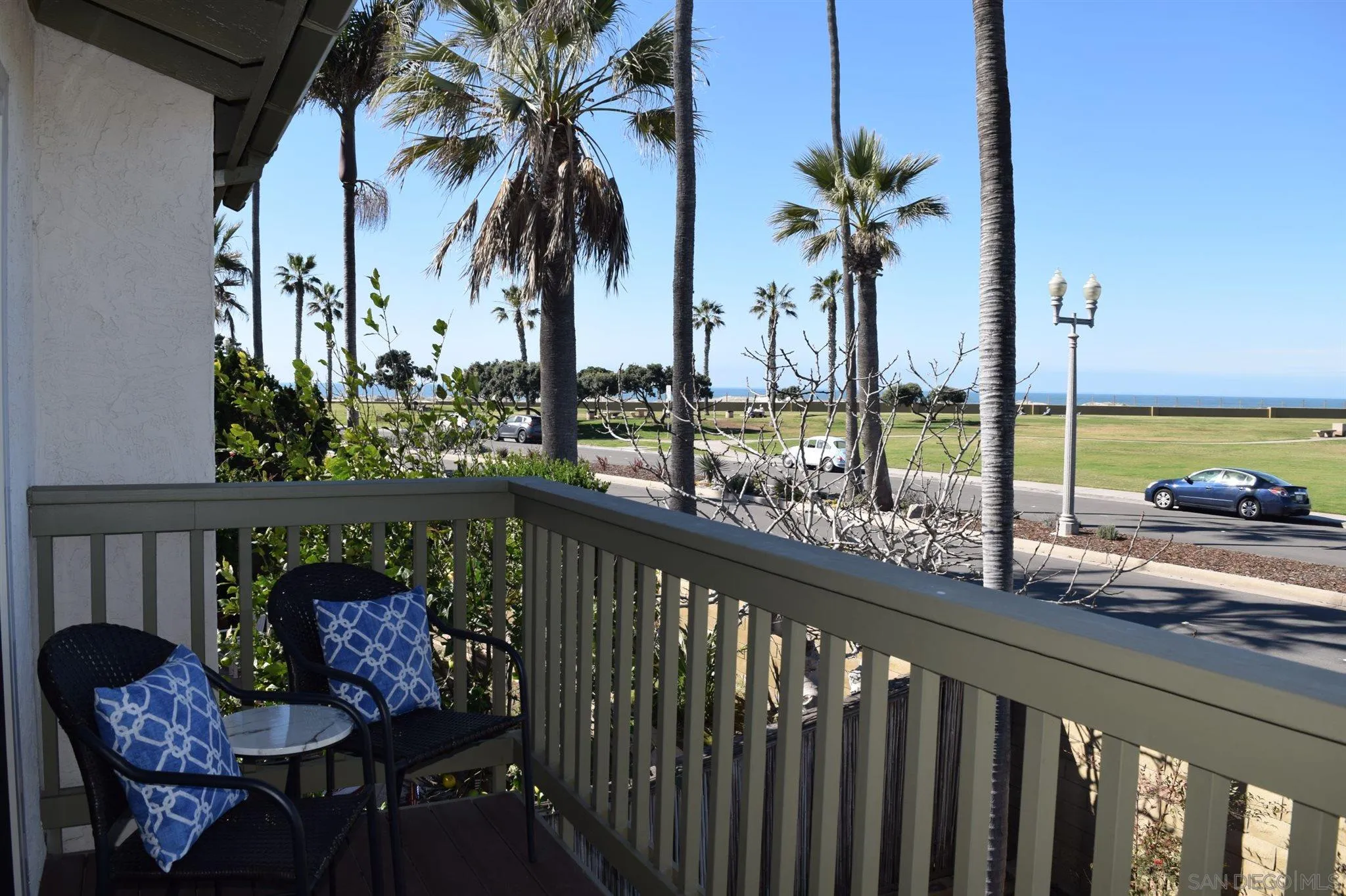 70 Trinidad Bend Coronado, CA 92118 - Photo 30 of 44 a view of a balcony with chairs and wooden fence