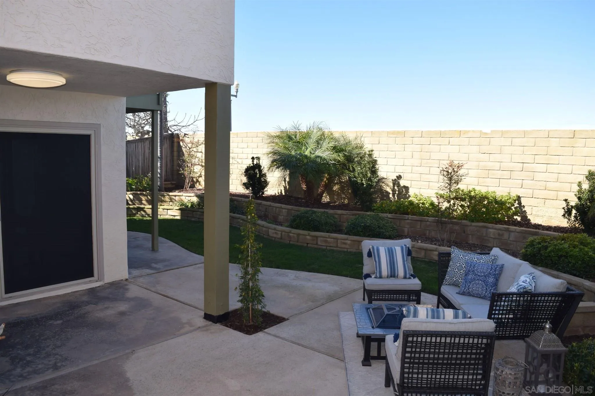 70 Trinidad Bend Coronado, CA 92118 - Photo 33 of 44 a view of a patio with table and chairs and potted plants