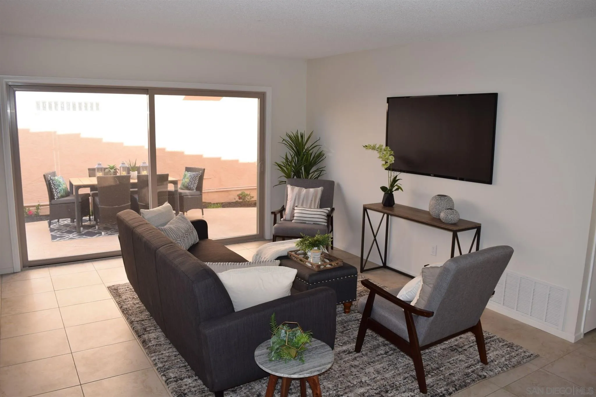 70 Trinidad Bend Coronado, CA 92118 - Photo 39 of 44 a living room with furniture and a flat screen tv