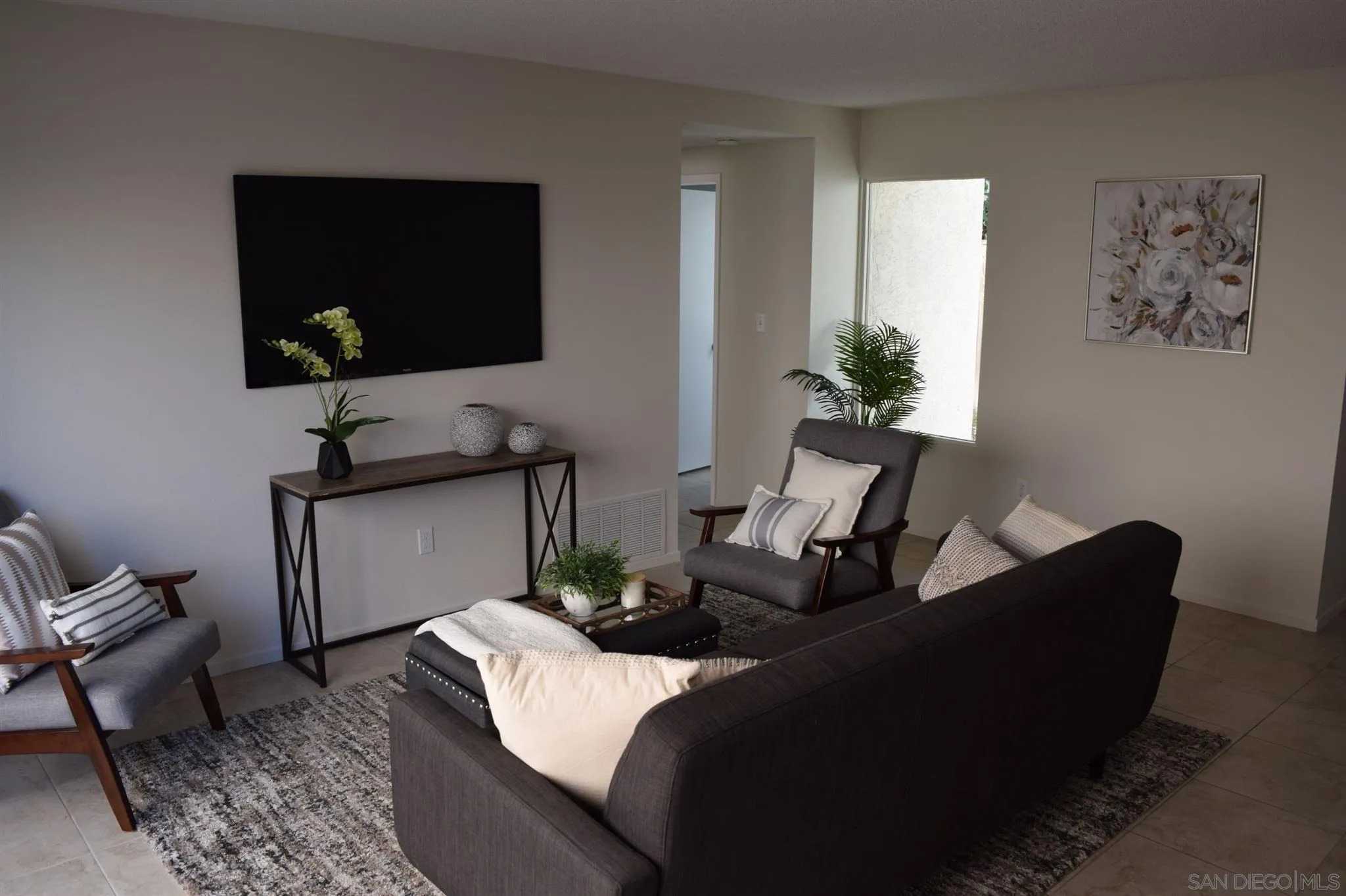 70 Trinidad Bend Coronado, CA 92118 - Photo 40 of 44 a living room with furniture and a flat screen tv