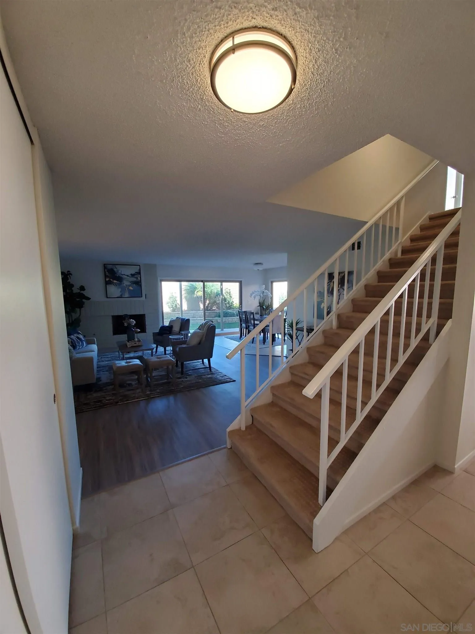70 Trinidad Bend Coronado, CA 92118 - Photo 4 of 44 a view of a livingroom with furniture and staircase