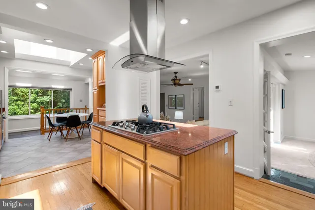 a kitchen with sink stove and refrigerator