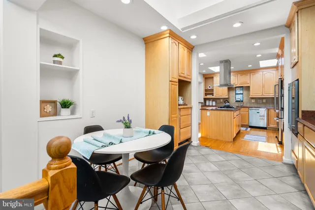 a view of a dining room with furniture and a kitchen