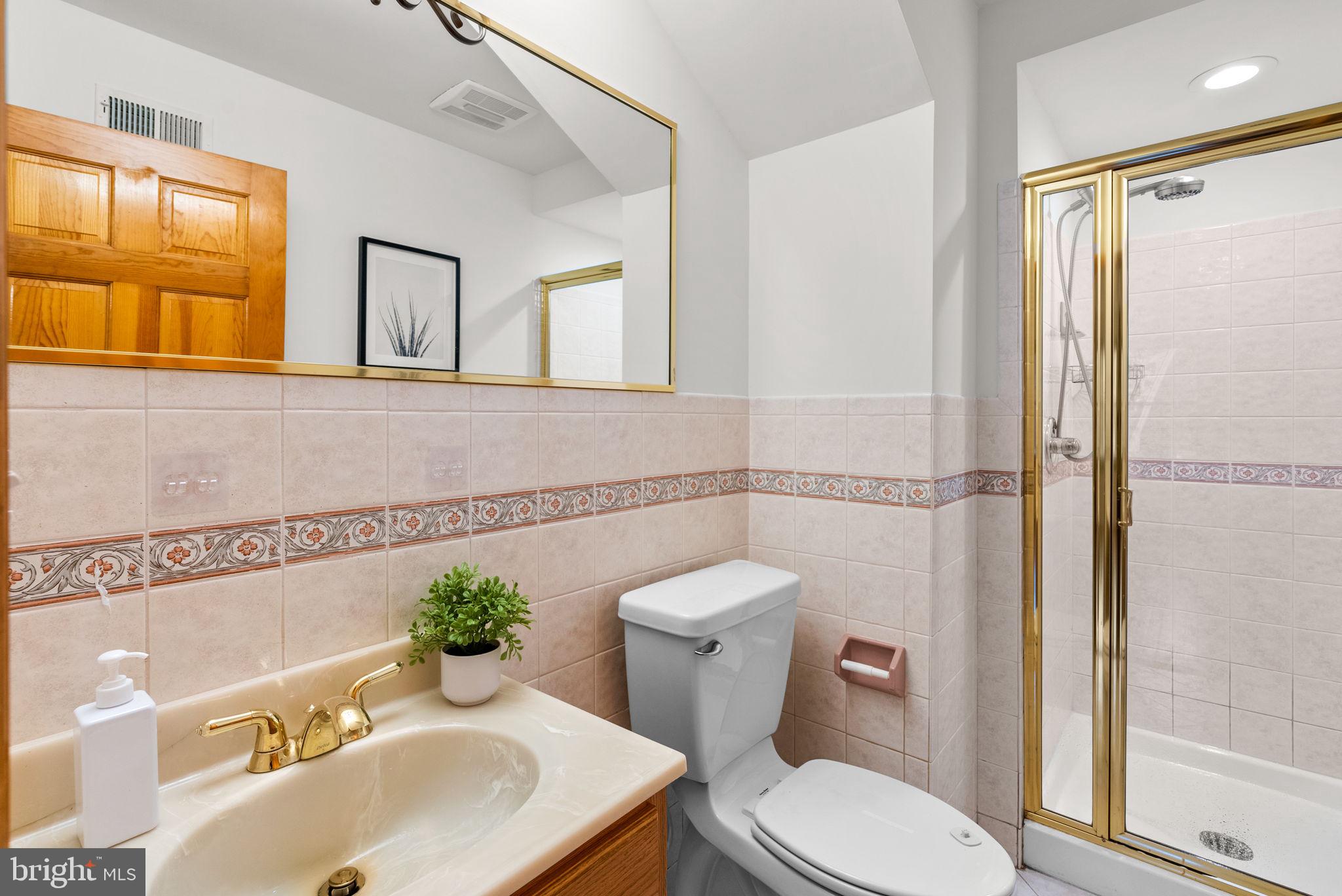 2816 Linden Lane Silver Spring, MD 20910 - Photo 21 of 62 a bathroom with a sink toilet and shower