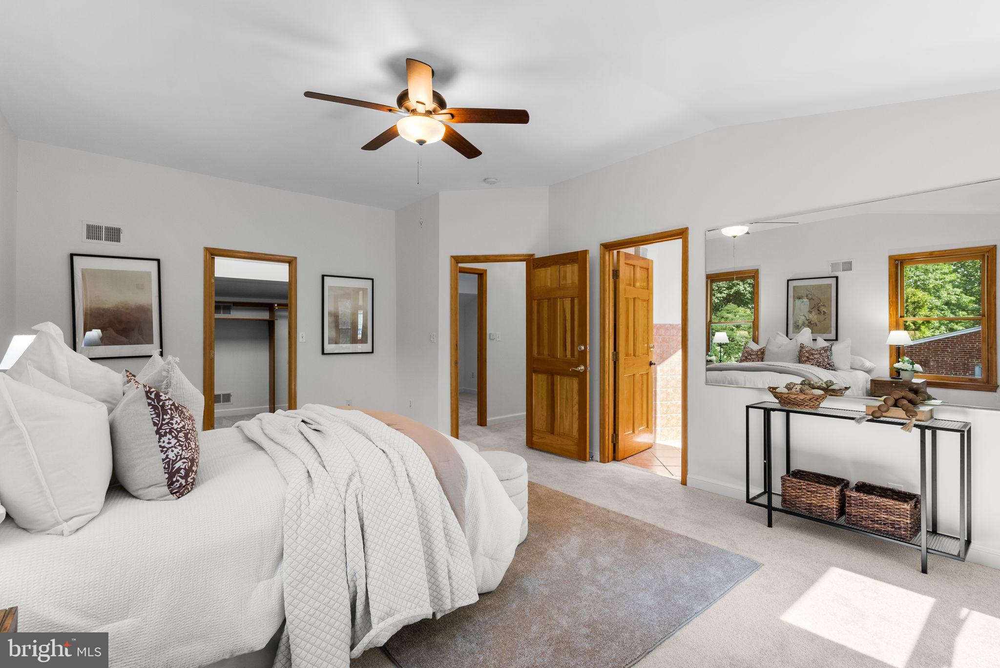 2816 Linden Lane Silver Spring, MD 20910 - Photo 27 of 62 a bedroom with a bed and a chandelier