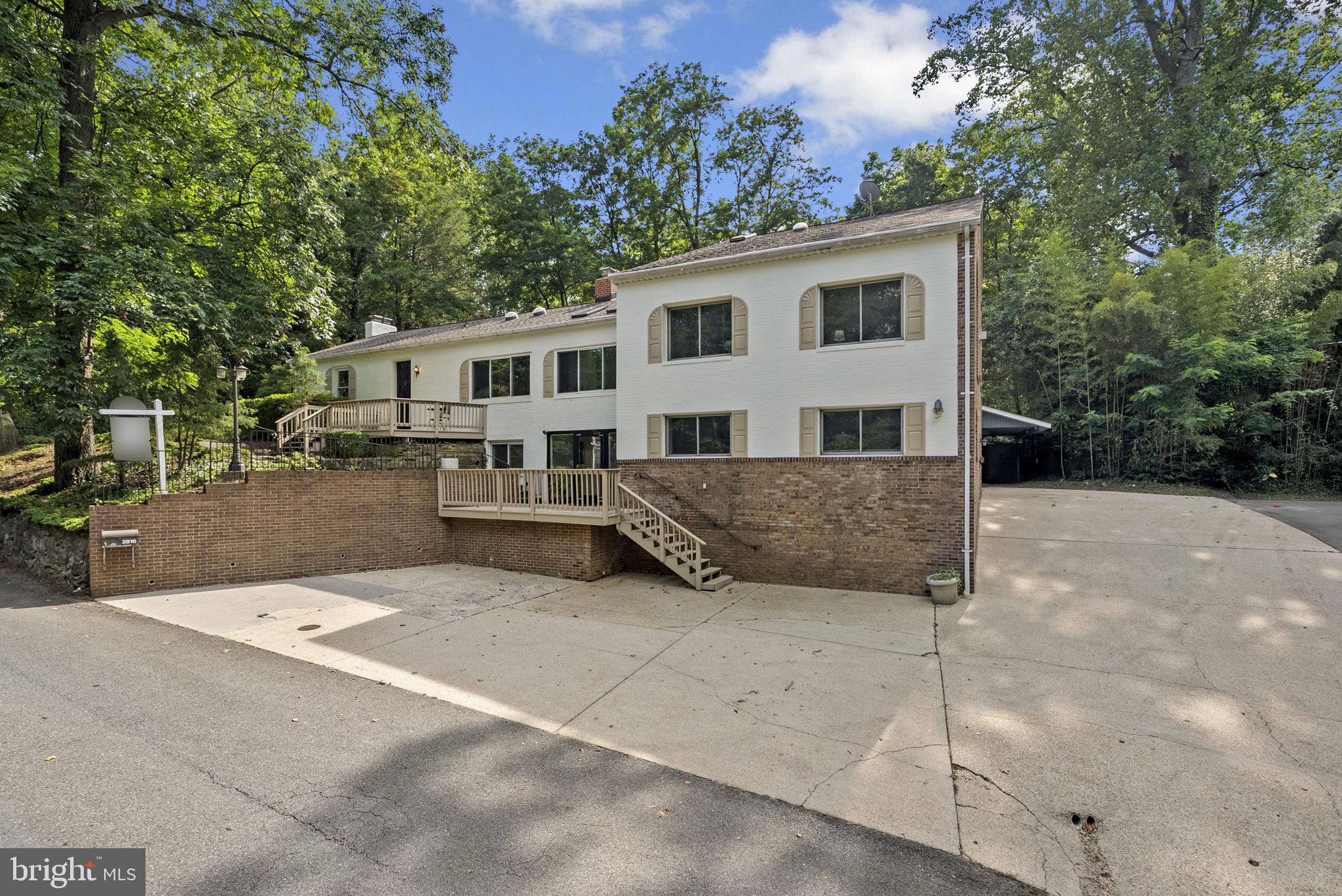 2816 Linden Lane Silver Spring, MD 20910 - Photo 3 of 62 a view of a house with a yard and large trees