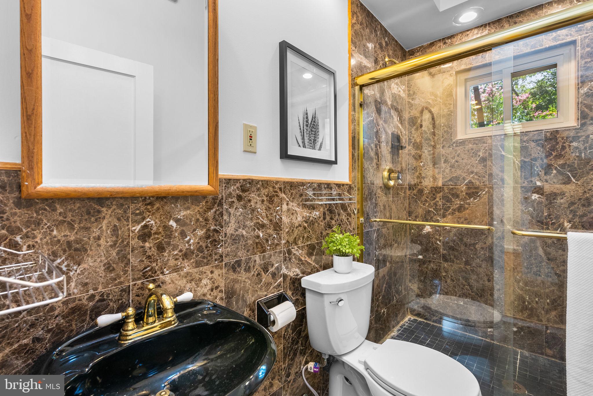 2816 Linden Lane Silver Spring, MD 20910 - Photo 33 of 62 a bathroom with a sink toilet and shower