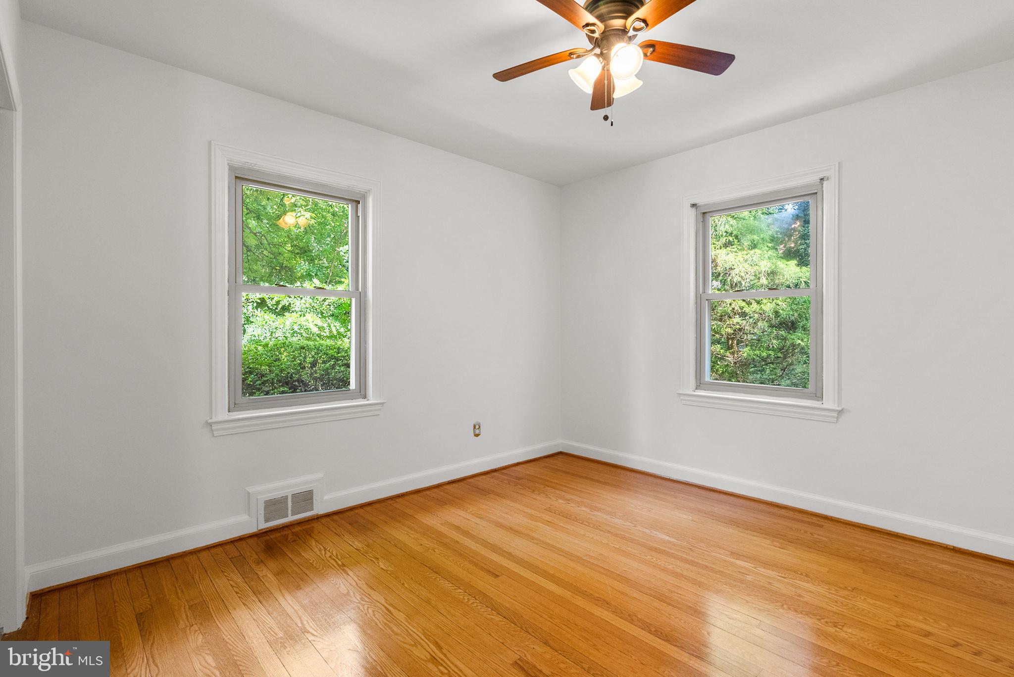 2816 Linden Lane Silver Spring, MD 20910 - Photo 34 of 62 a view of an empty room with wooden floor and a window
