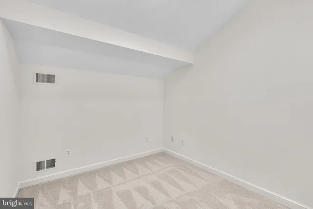 a view of a wooden deck with a bench