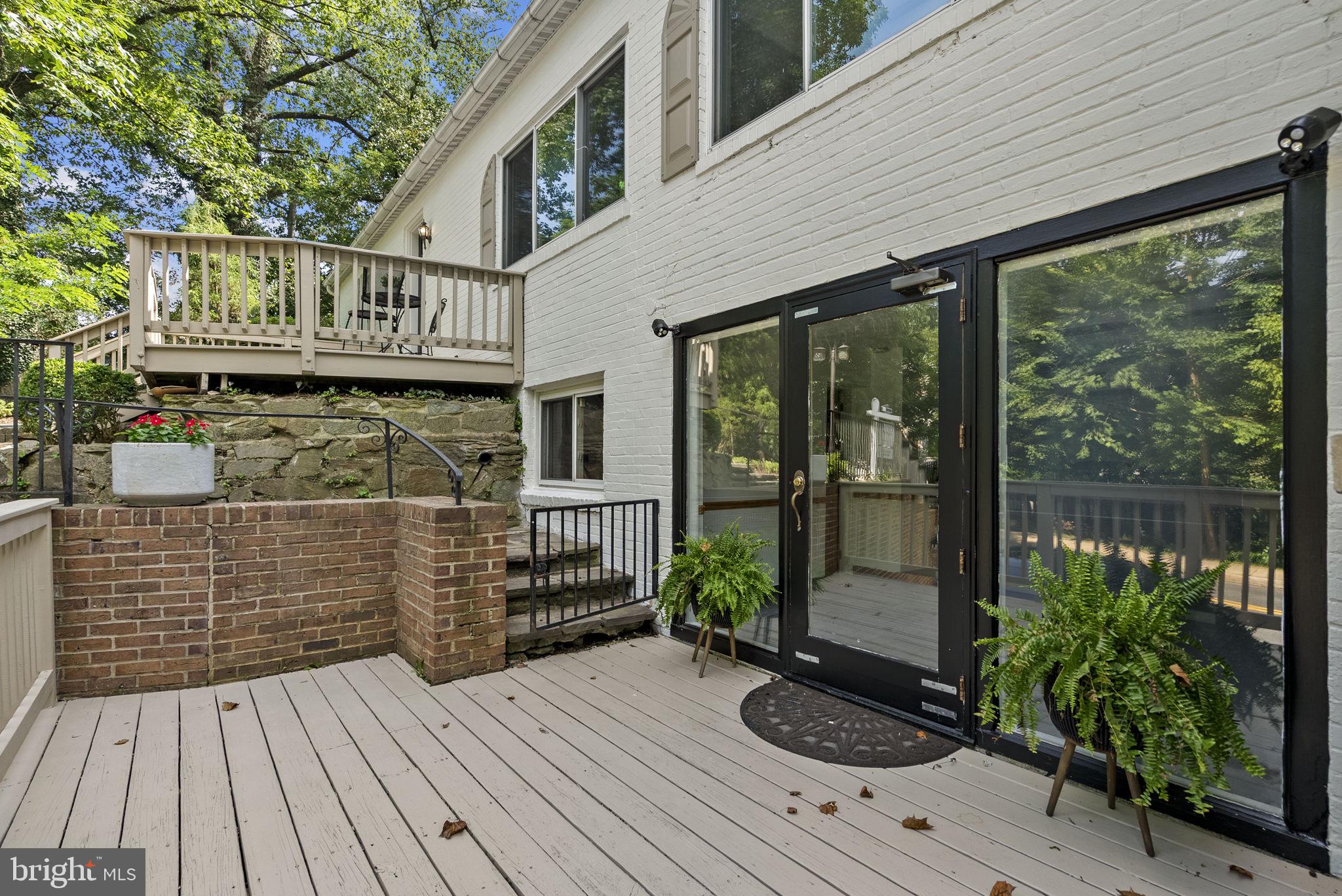2816 Linden Lane Silver Spring, MD 20910 - Photo 37 of 62 a view of a wooden deck with a bench