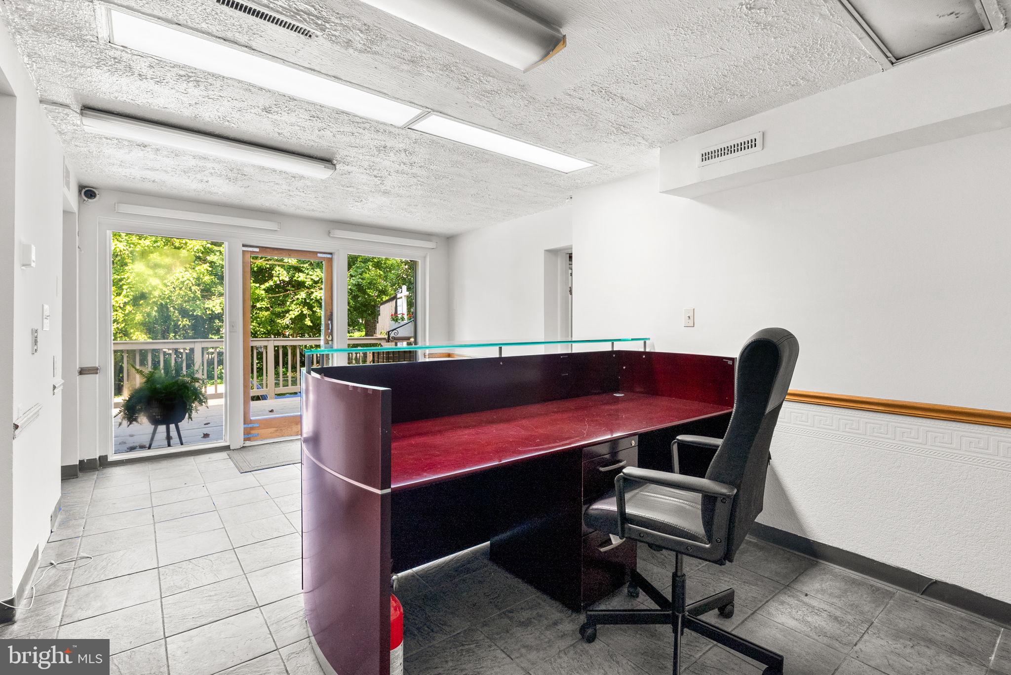 2816 Linden Lane Silver Spring, MD 20910 - Photo 39 of 62 a room with a table chair and a large window