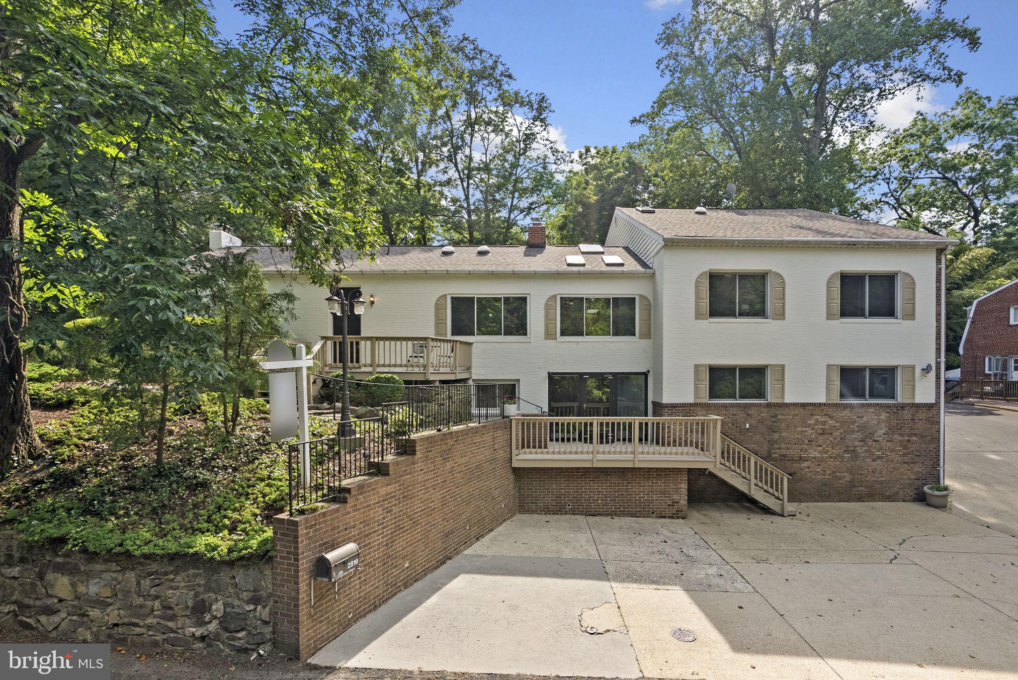 2816 Linden Lane Silver Spring, MD 20910 - Photo 4 of 62 a front view of a house with a yard and garage