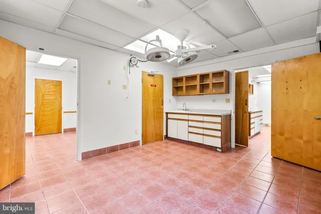 a bathroom with a sink and a large mirror