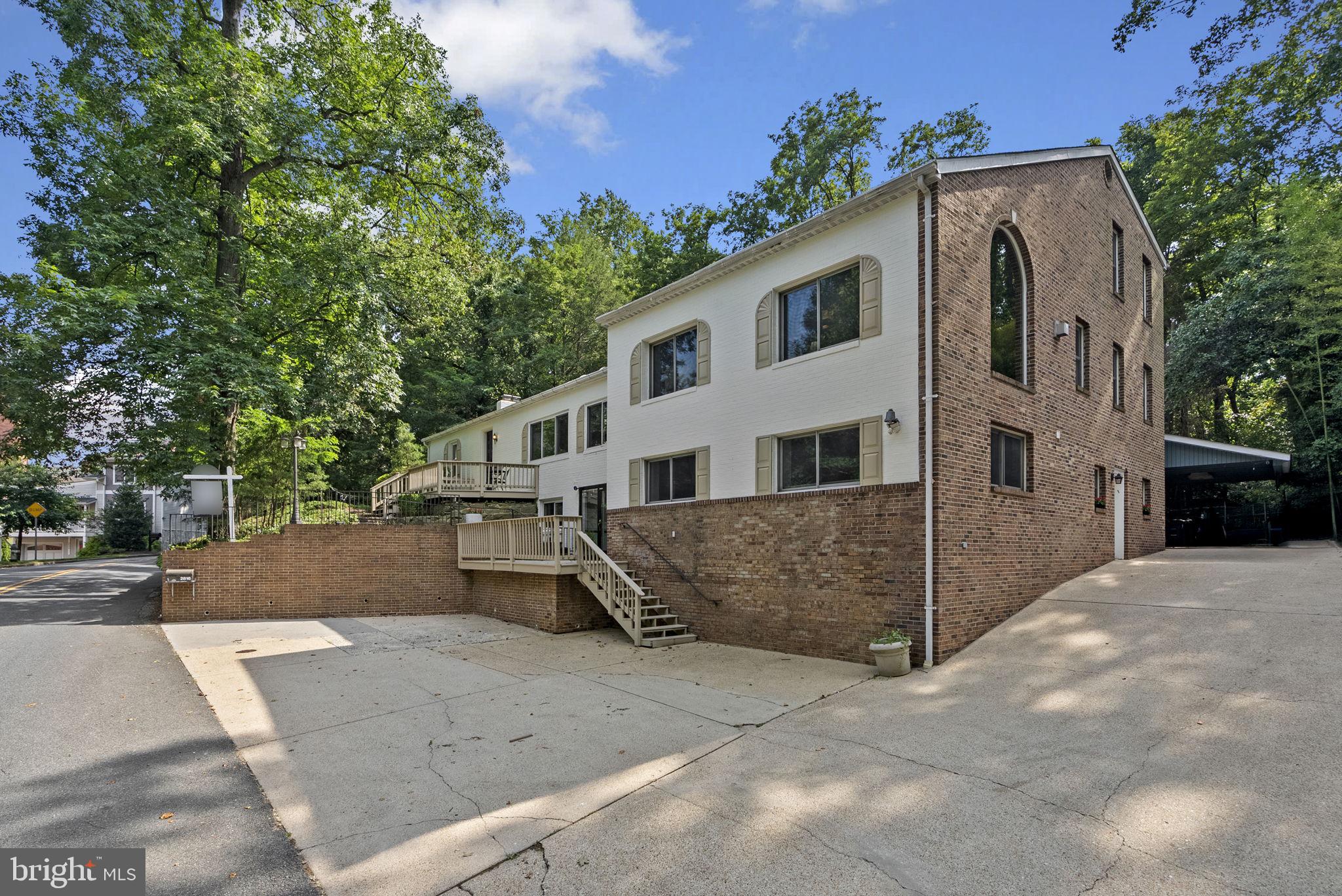 2816 Linden Lane Silver Spring, MD 20910 - Photo 5 of 62 a view of a white house with a yard and large tree