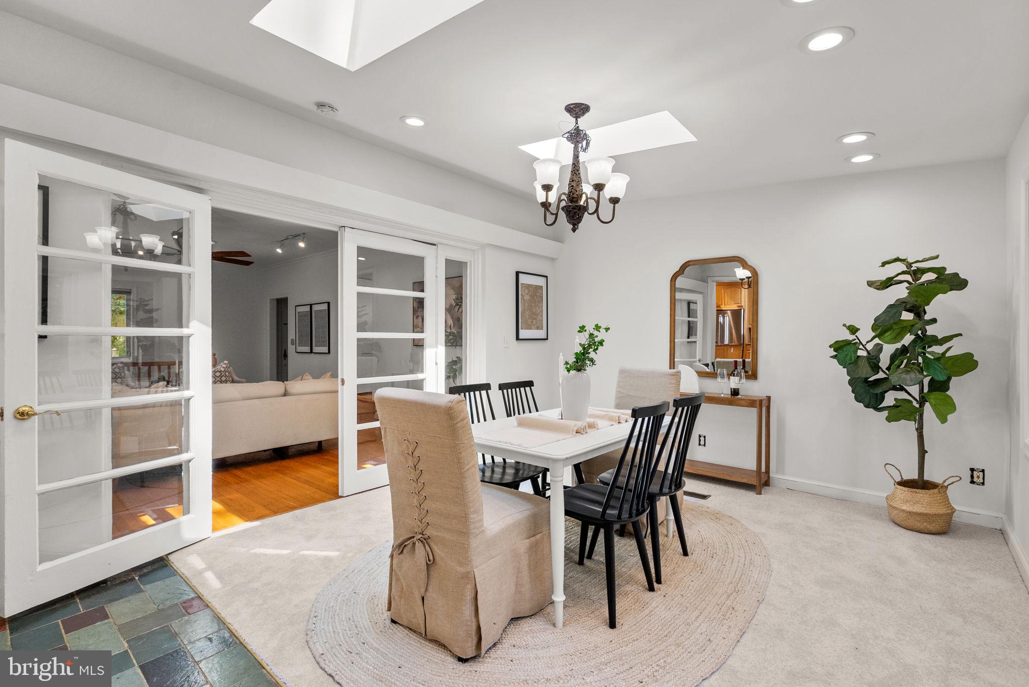 2816 Linden Lane Silver Spring, MD 20910 - Photo 9 of 62 a view of a dining room with furniture and a potted plant