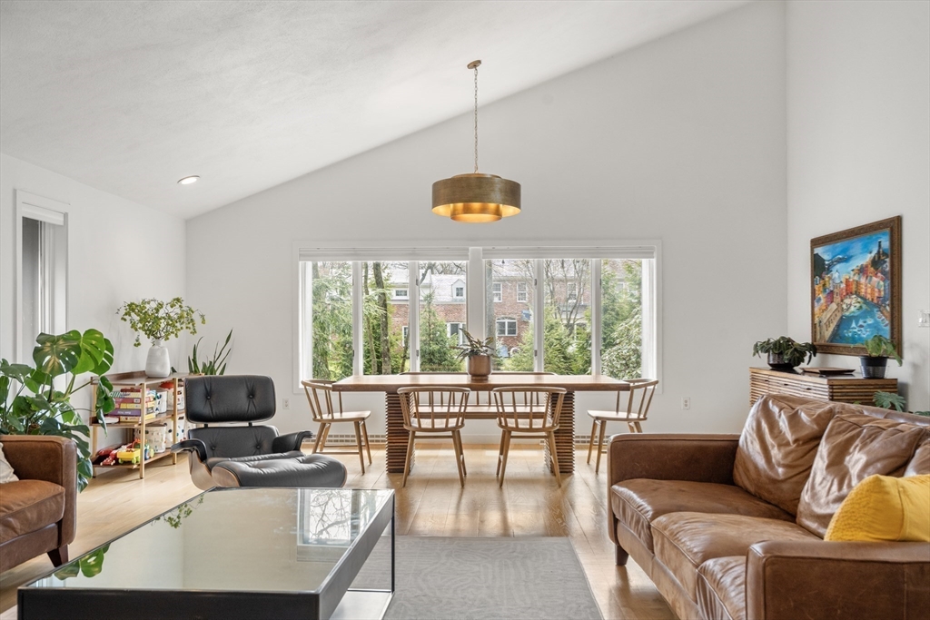 811 Hammond Street Chestnut Hill, MA 02467 - Photo 2 of 30 a living room with furniture and a floor to ceiling window