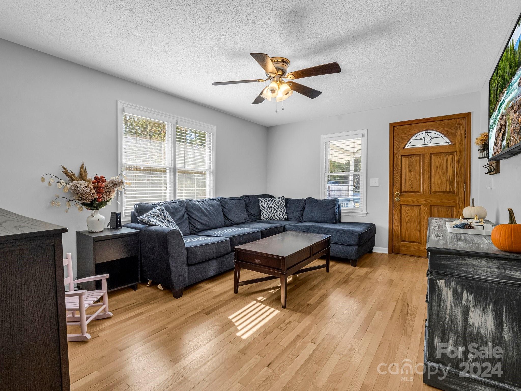 4196 Peachtree Road Inman, SC 29349 - Photo 7 of 31 a living room with furniture and a chandelier