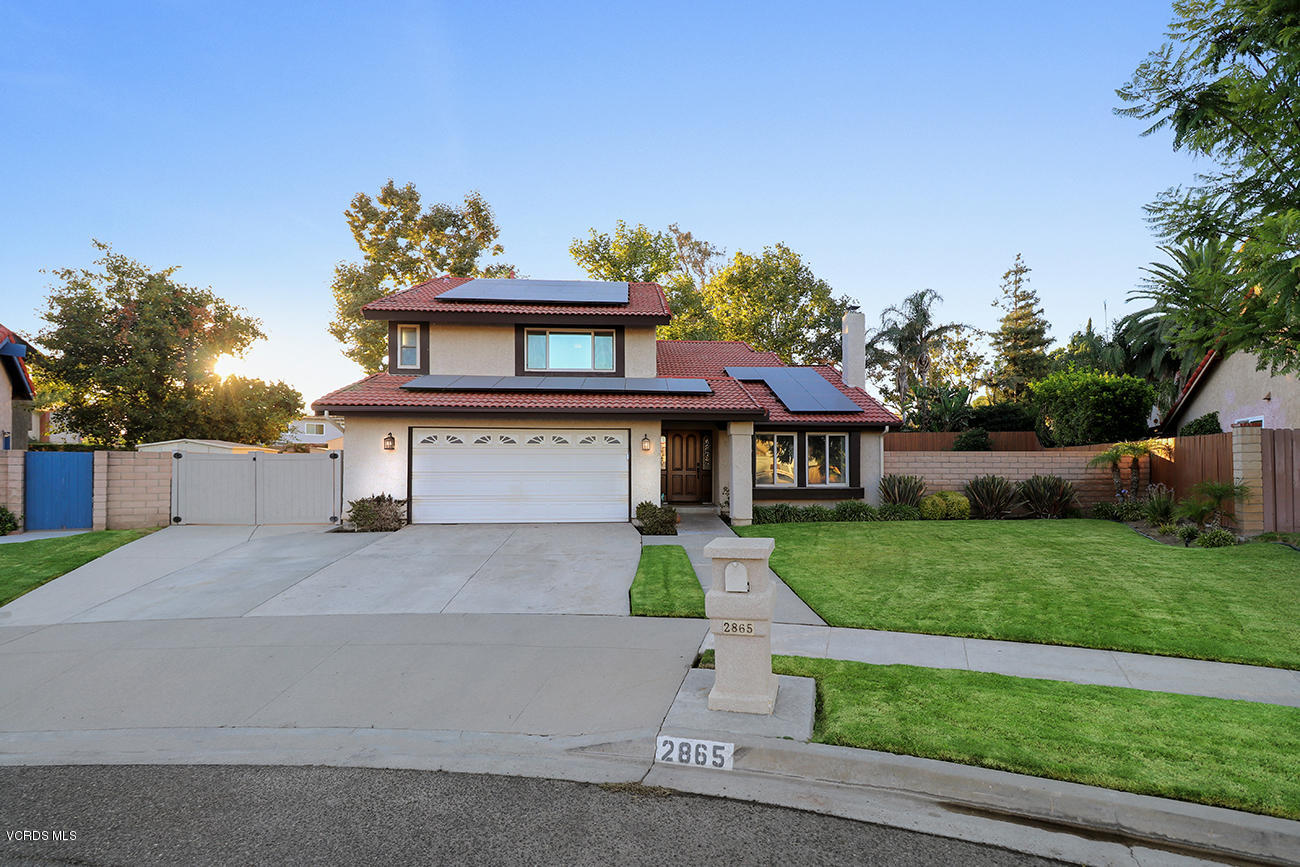 2865 Ian Lane Simi Valley, CA 93063 - Photo 1 of 1 a front view of a house with a yard and a garage