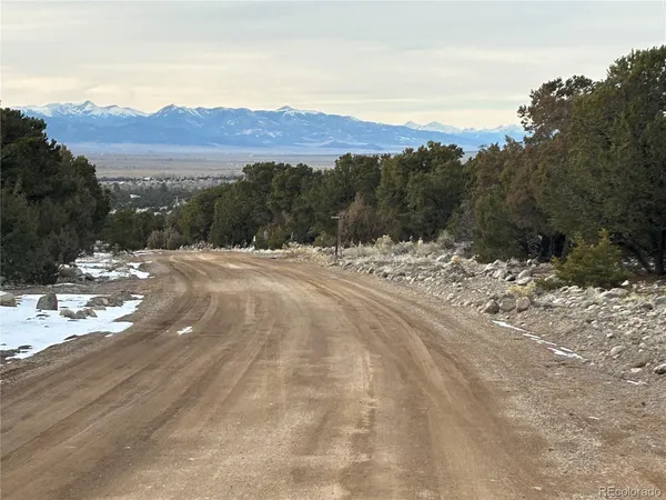 a view of a road with a building in the background