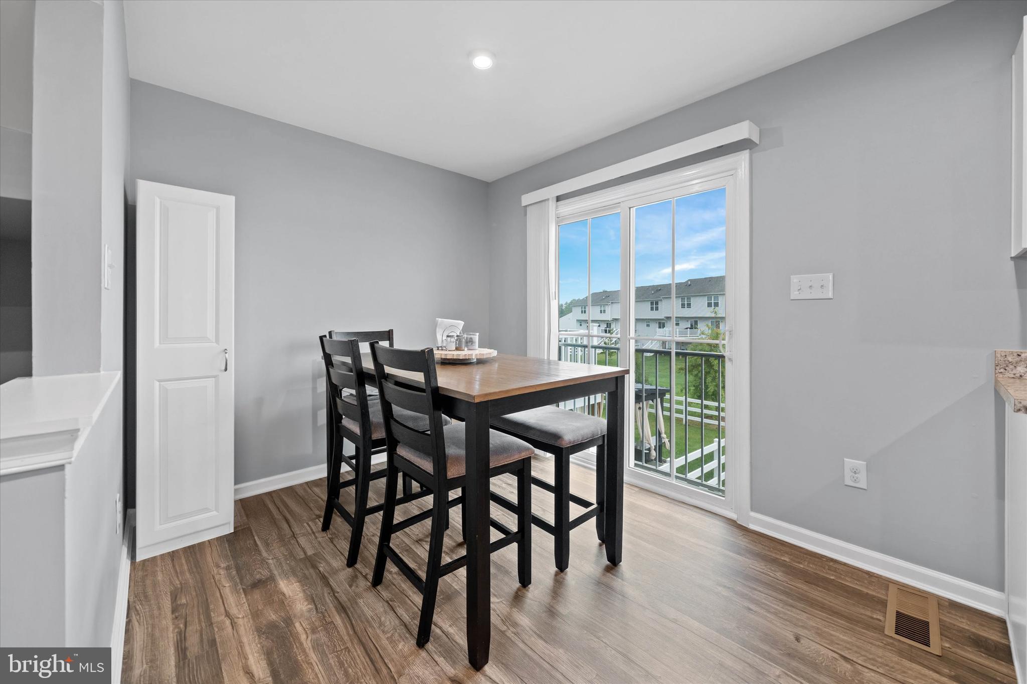 309 Mingo Way Townsend, DE 19734 - Photo 11 of 35 a view of a dining room with furniture window and wooden floor