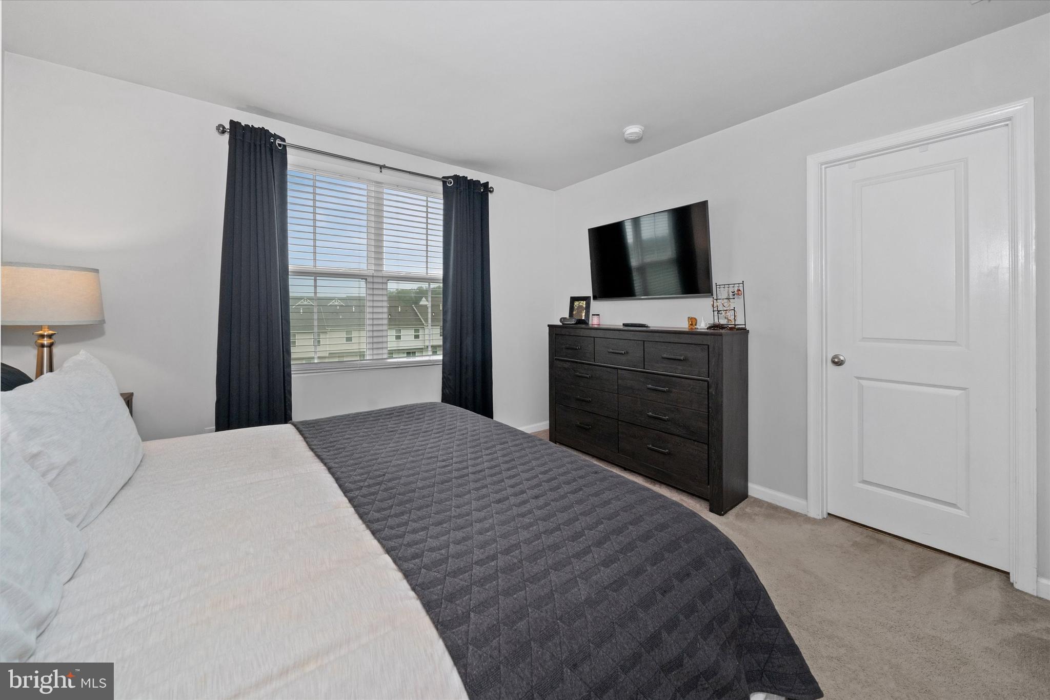 309 Mingo Way Townsend, DE 19734 - Photo 19 of 35 a bedroom with a bed and flat screen tv