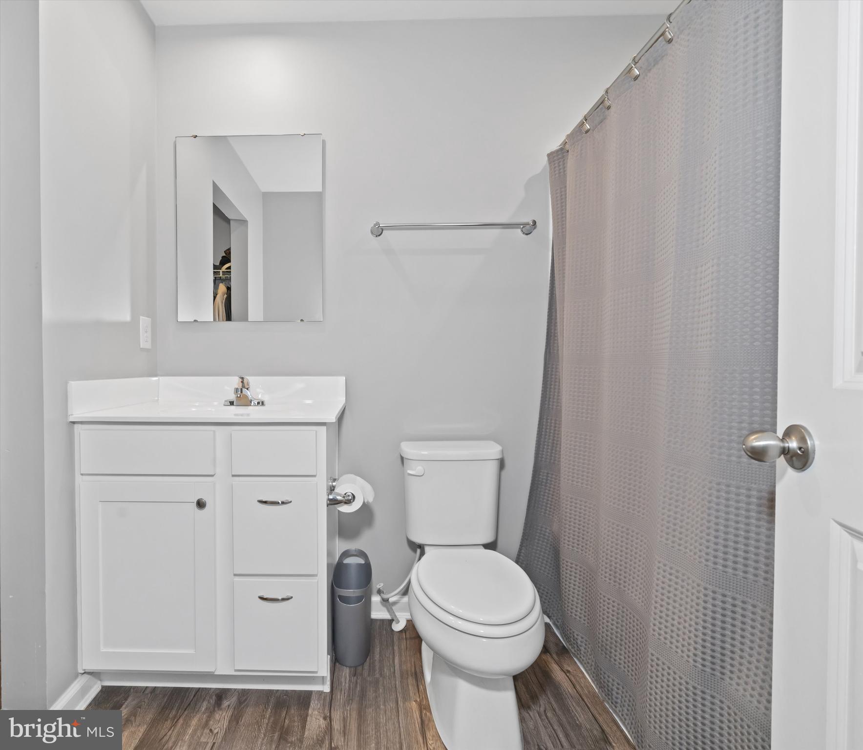 309 Mingo Way Townsend, DE 19734 - Photo 23 of 35 a bathroom with a toilet a sink a vanity and mirror