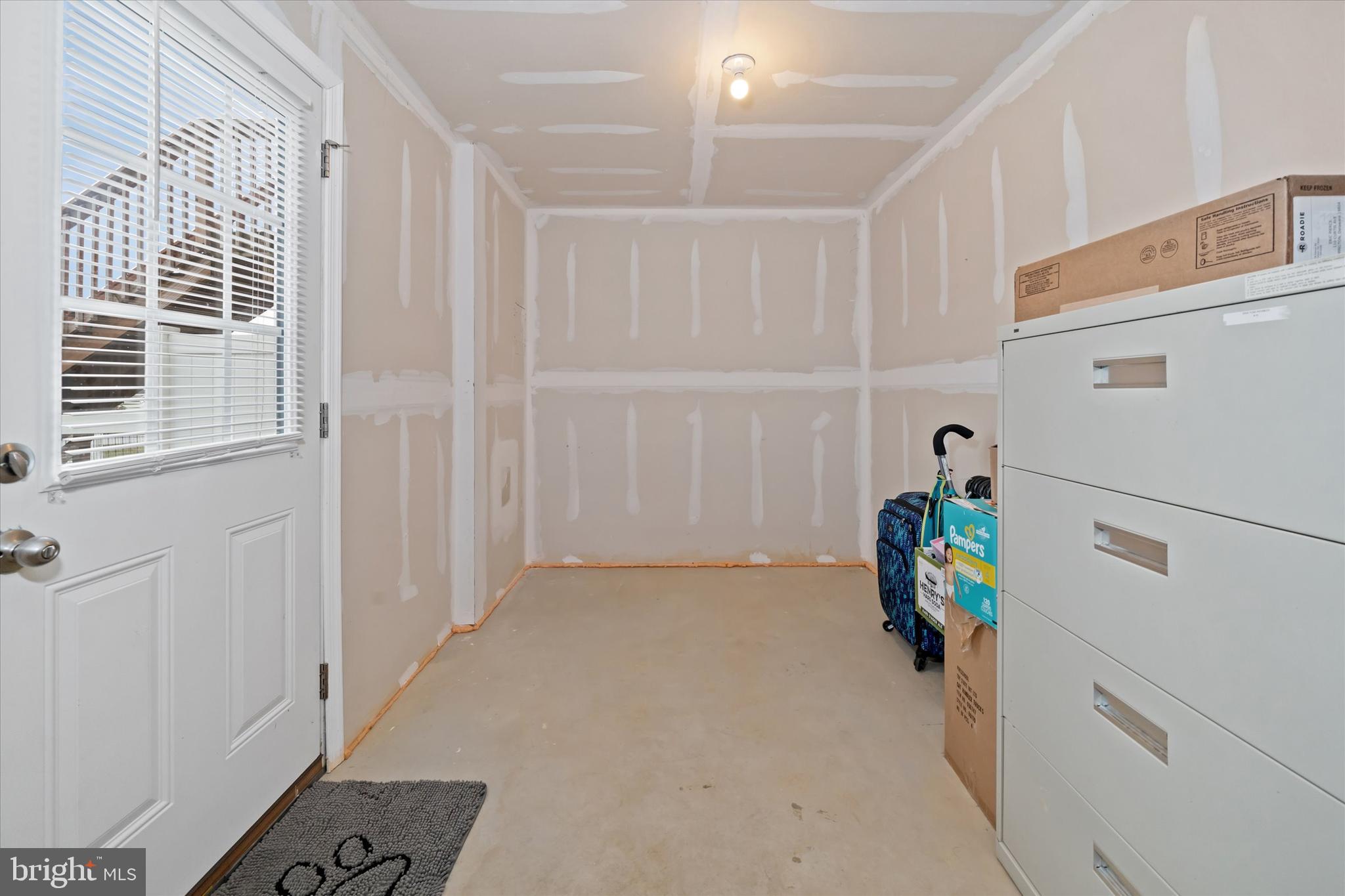 309 Mingo Way Townsend, DE 19734 - Photo 32 of 35 a view of hallway with refrigerator and toys
