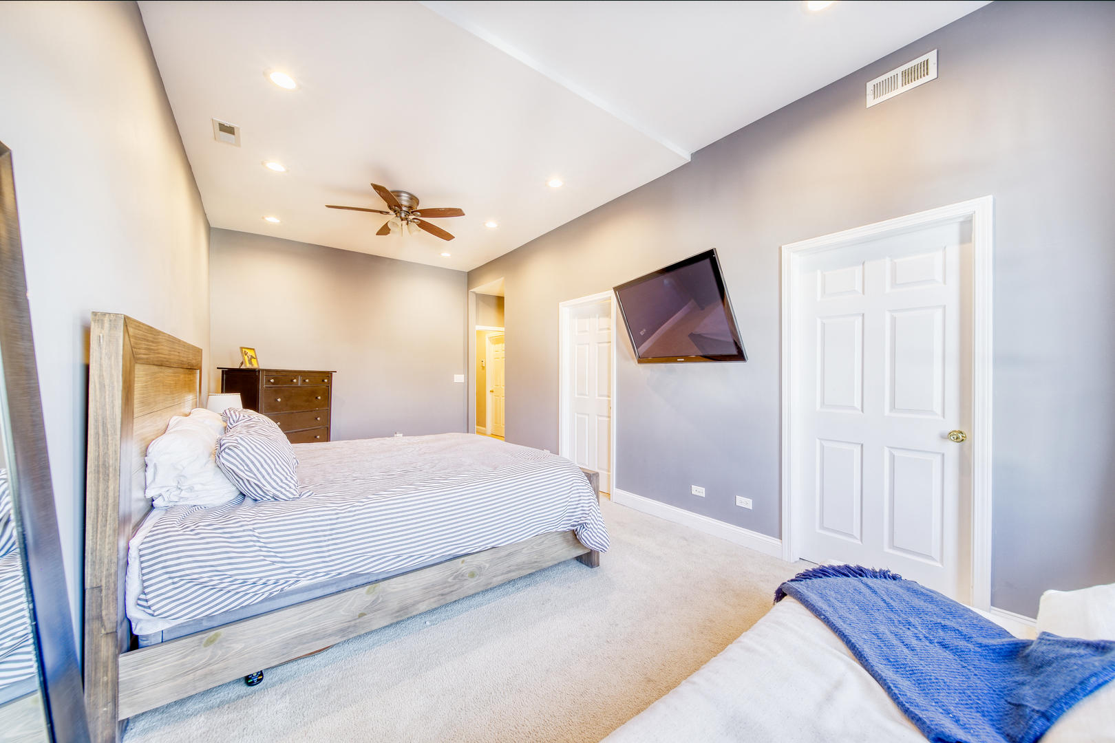 1663 North Richmond Street Chicago, IL 60647 - Photo 12 of 29 a bedroom with a large bed and a chandelier