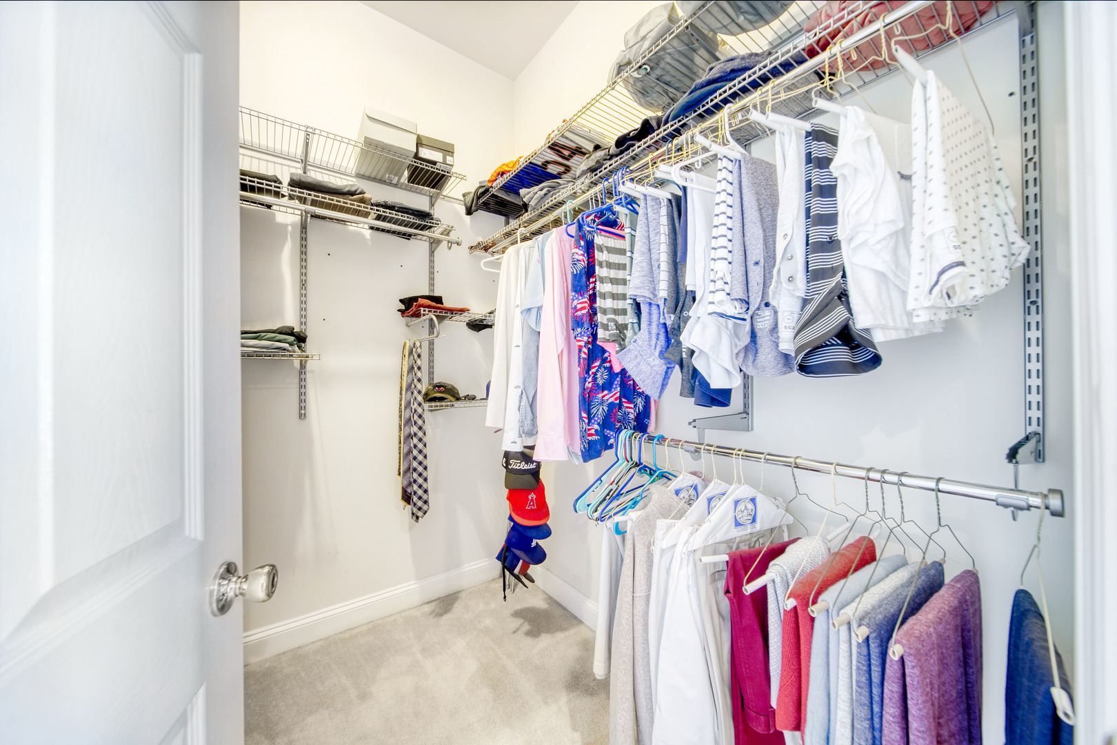 1663 North Richmond Street Chicago, IL 60647 - Photo 15 of 29 a view of walk in closet with clothes and shoes