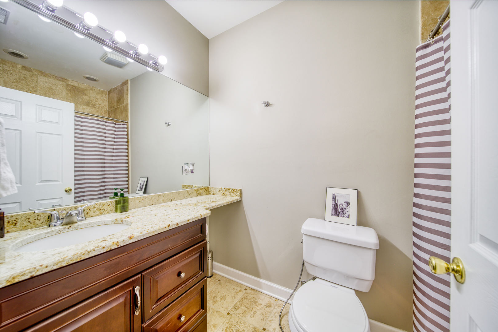 1663 North Richmond Street Chicago, IL 60647 - Photo 20 of 29 a bathroom with a granite countertop toilet sink and mirror