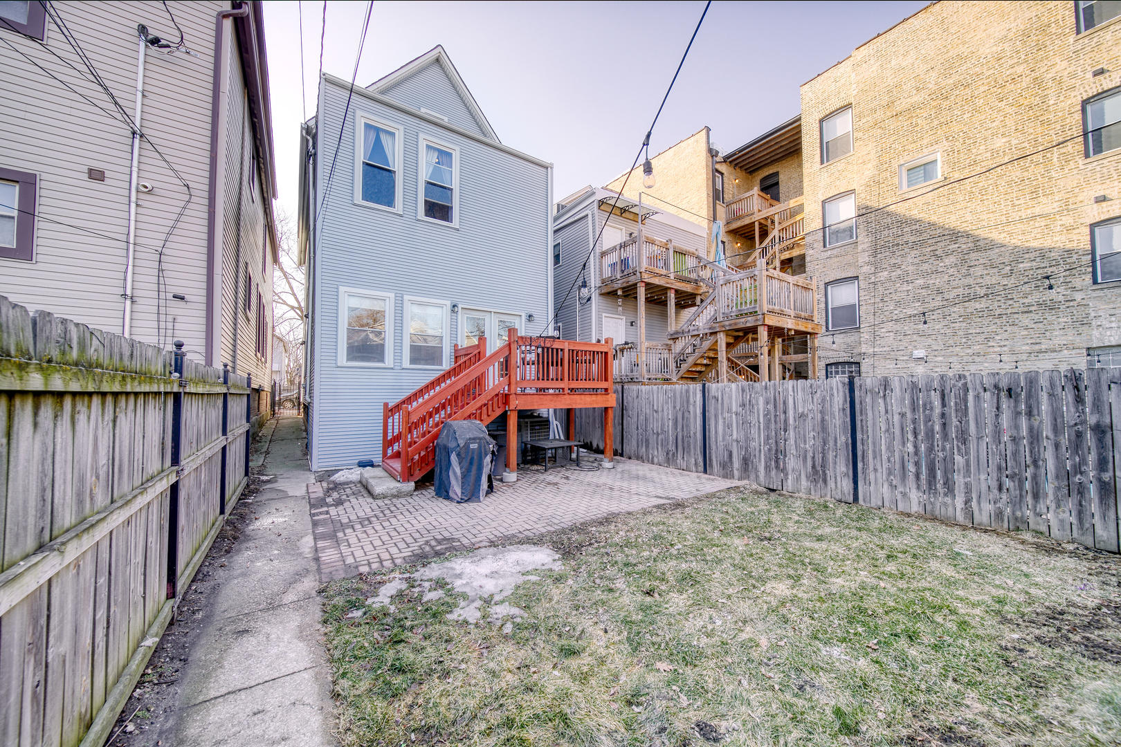 1663 North Richmond Street Chicago, IL 60647 - Photo 28 of 29 a view of a house with a yard and wooden fence