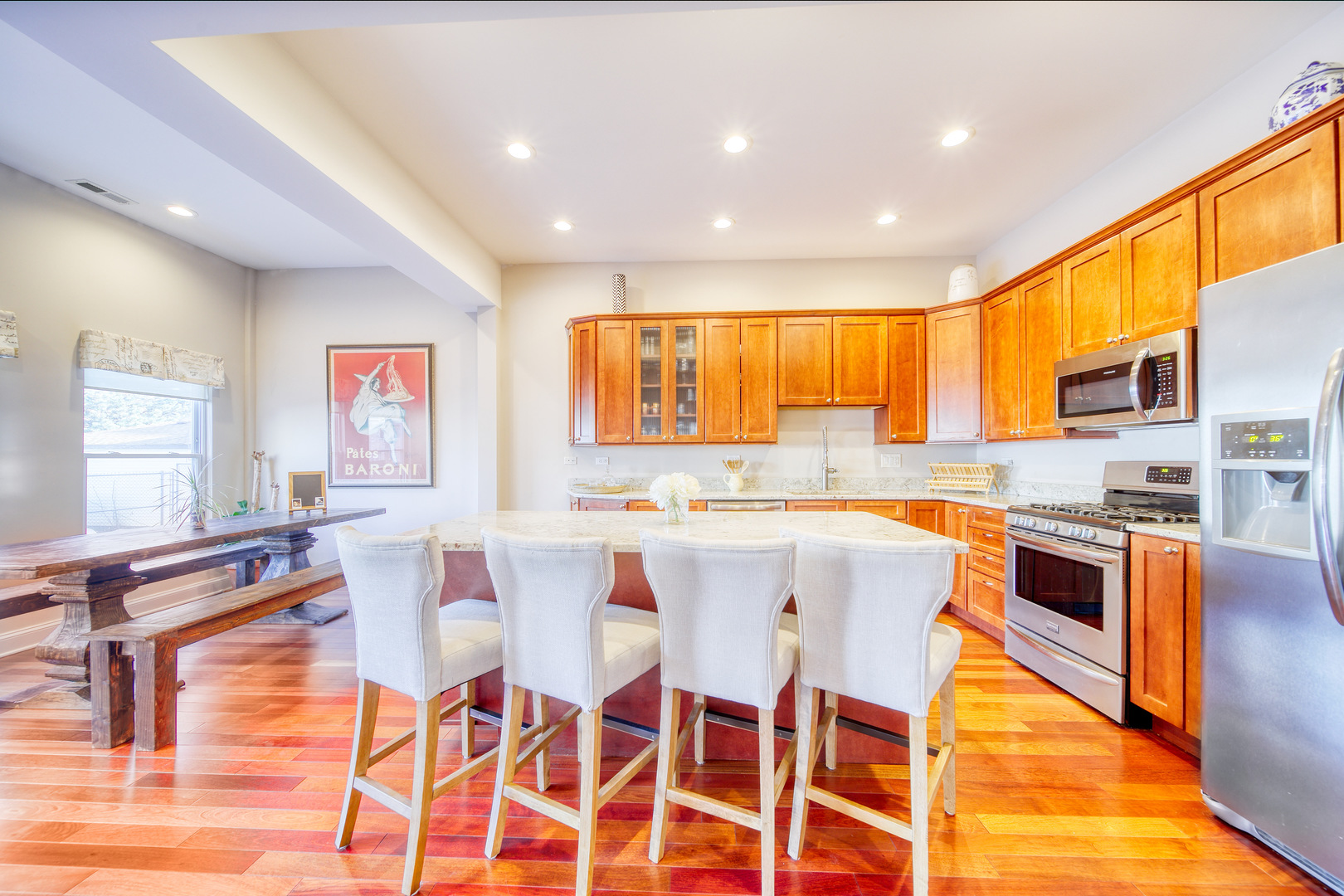 1663 North Richmond Street Chicago, IL 60647 - Photo 7 of 29 a large kitchen with a table and chairs in it