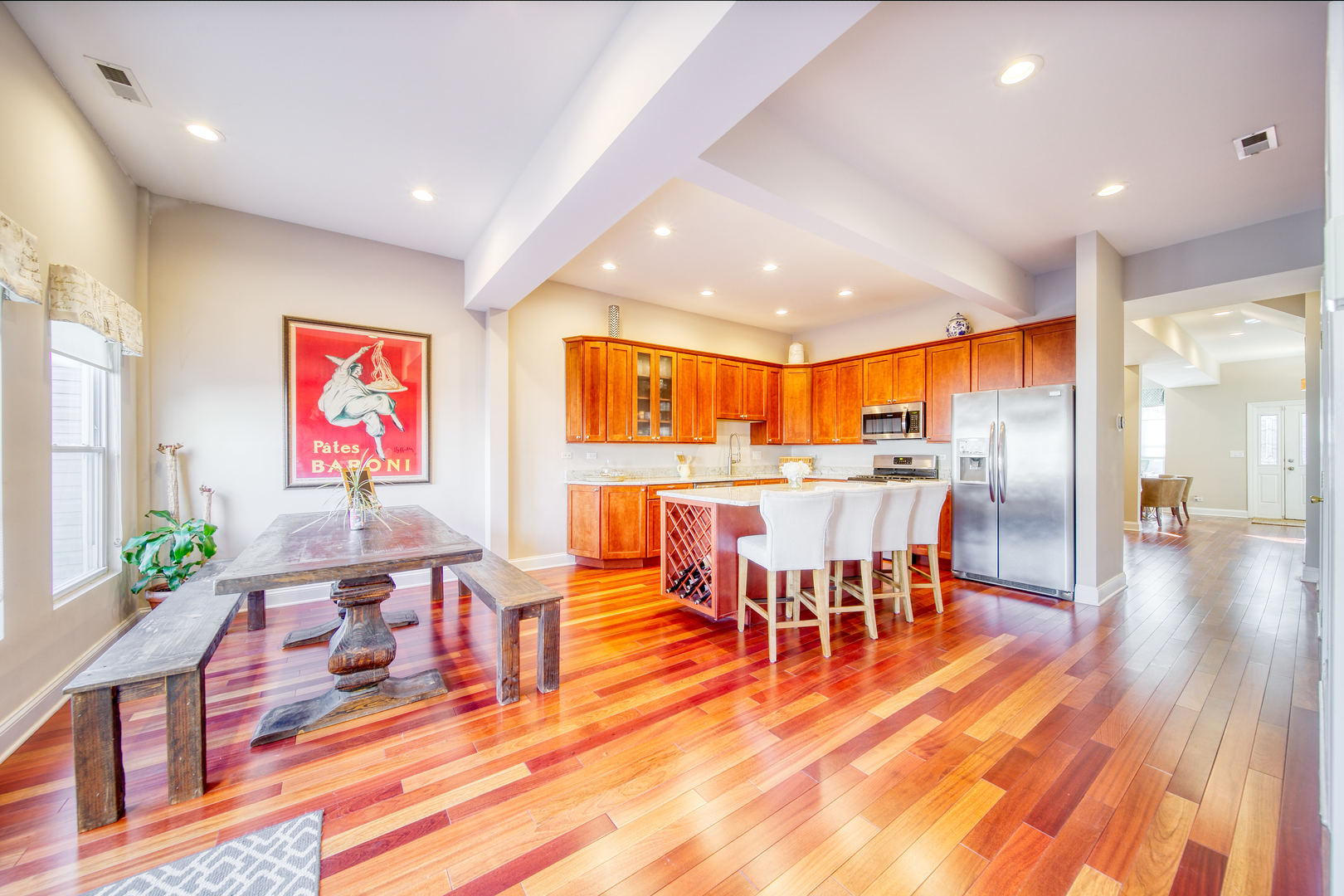 1663 North Richmond Street Chicago, IL 60647 - Photo 8 of 29 an open kitchen with dining table and chairs