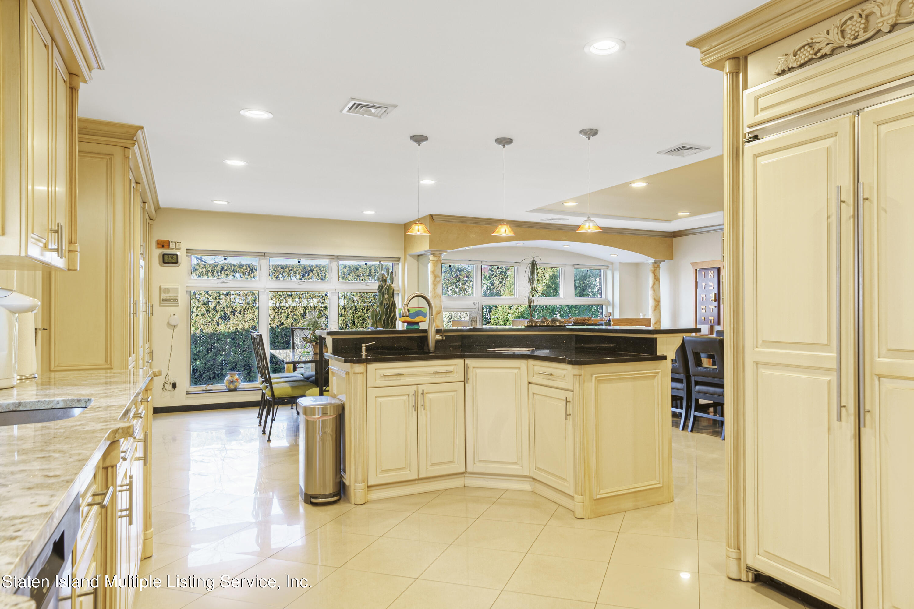 19 Bascom Place Staten Island, NY 10314 - Photo 14 of 54 a kitchen with stainless steel appliances granite countertop a sink and cabinets