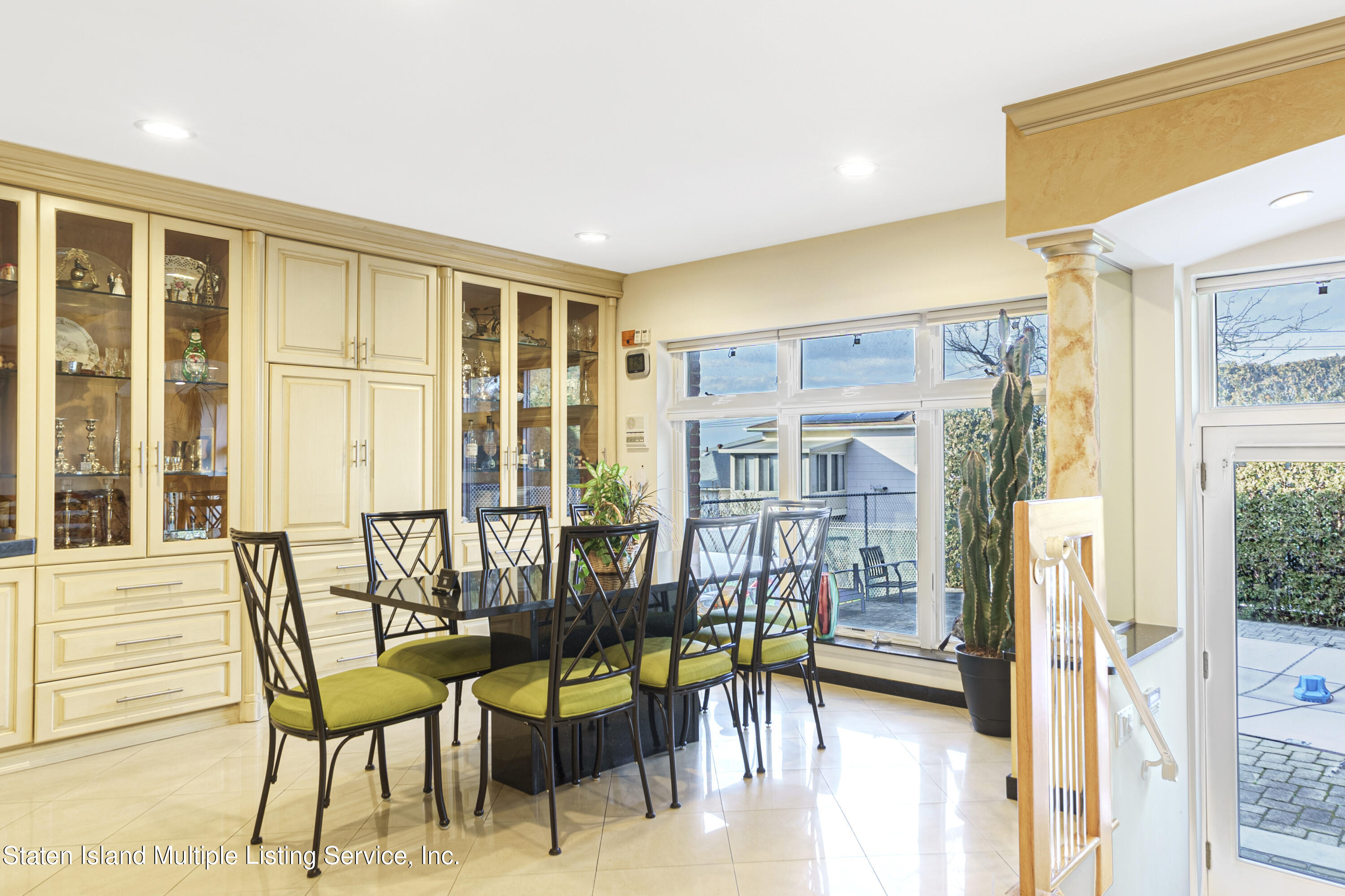 19 Bascom Place Staten Island, NY 10314 - Photo 15 of 54 a view of a dining room with furniture and a window