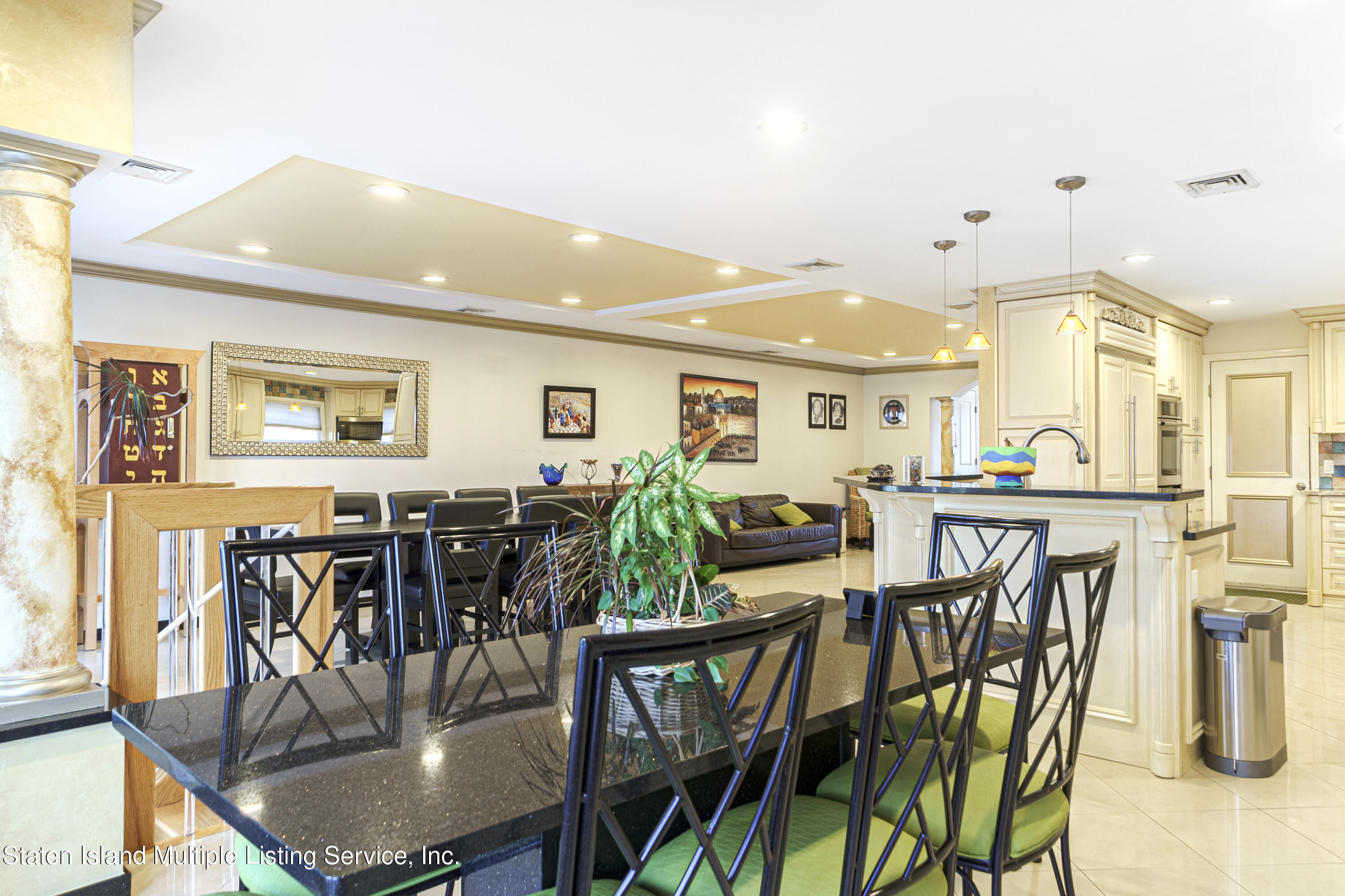 19 Bascom Place Staten Island, NY 10314 - Photo 16 of 54 a view of a dining room with furniture and wooden floor