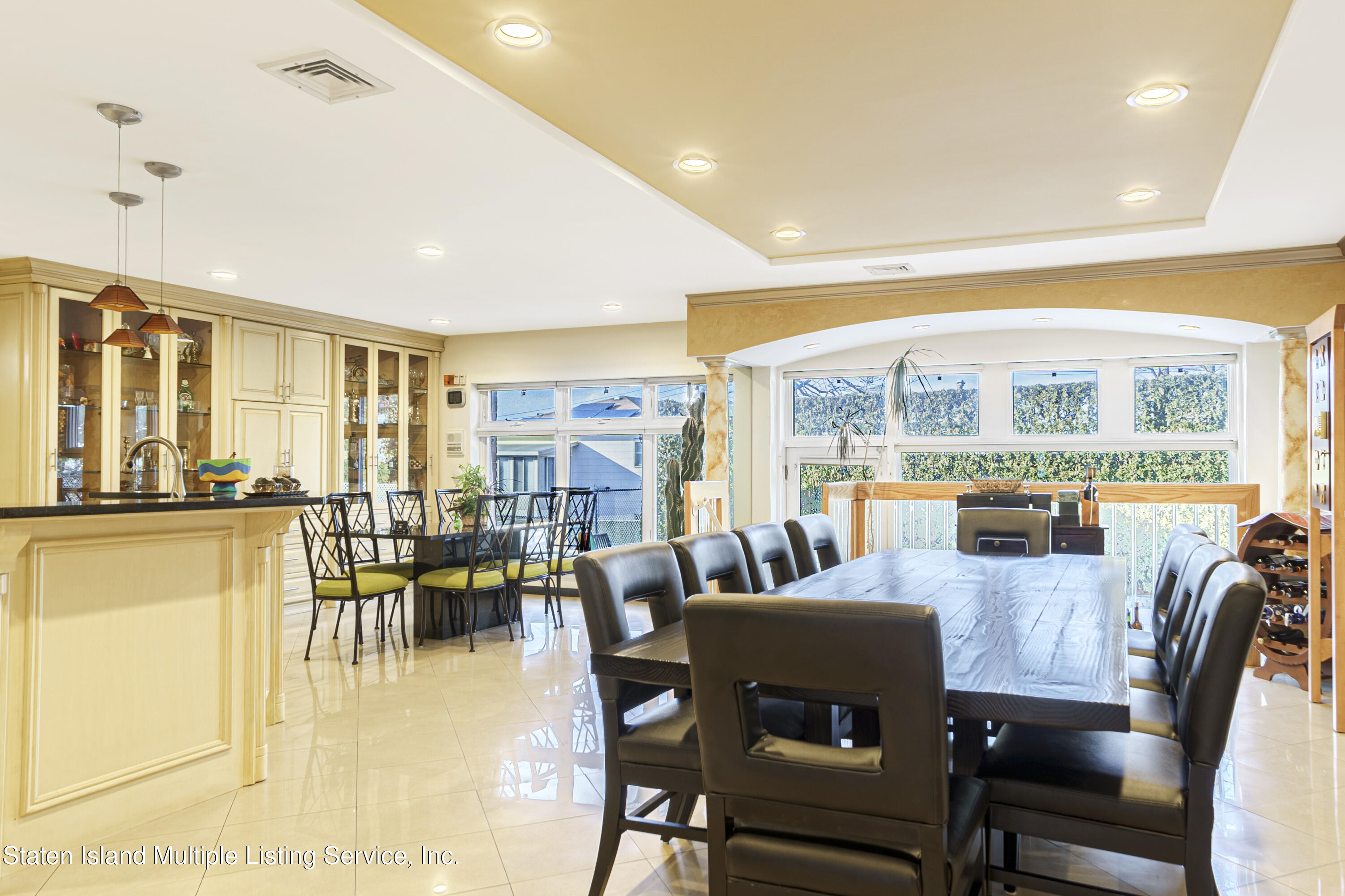 19 Bascom Place Staten Island, NY 10314 - Photo 17 of 54 a dining room with furniture water view and large windows