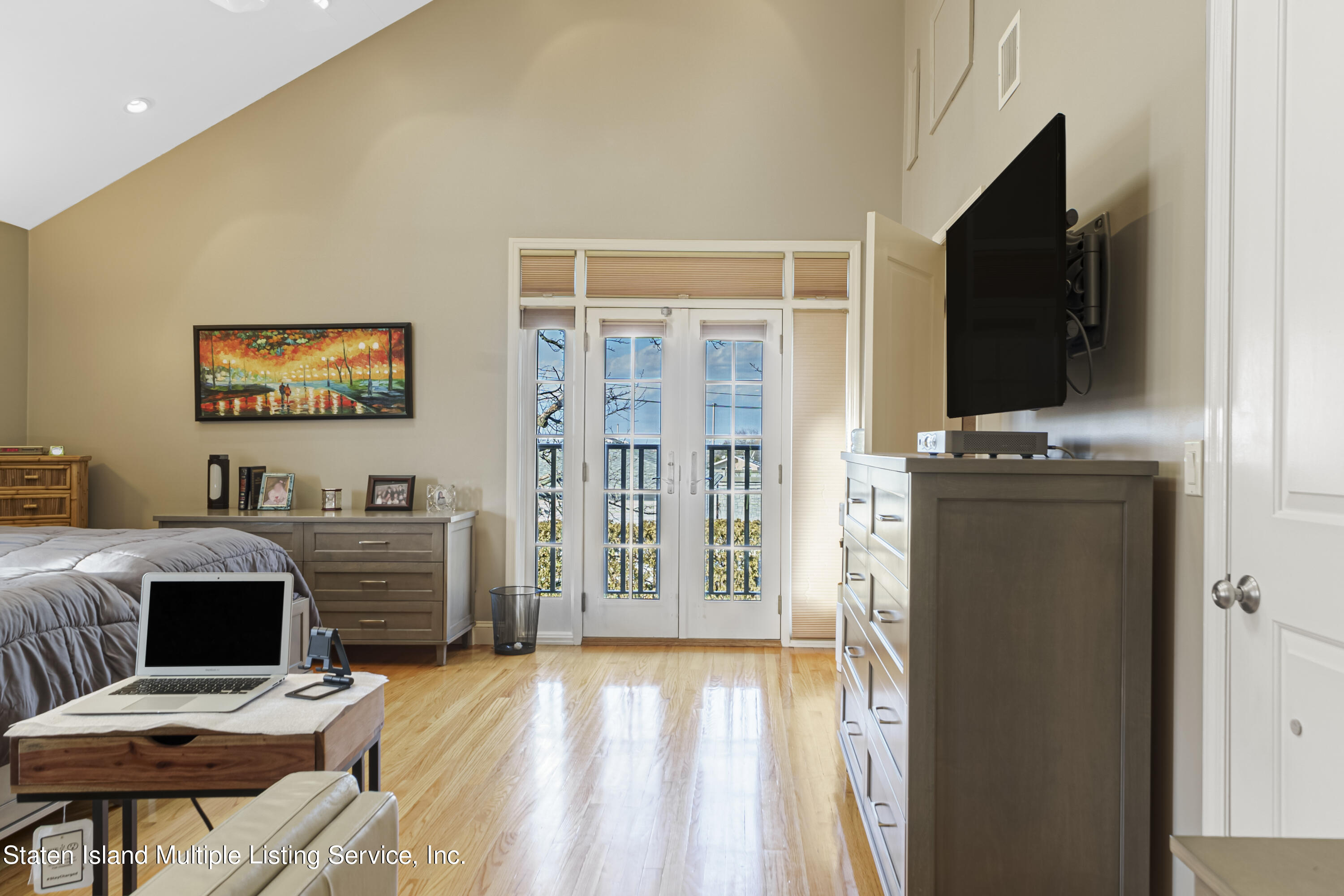 19 Bascom Place Staten Island, NY 10314 - Photo 21 of 54 a view of a livingroom with furniture and a flat screen tv