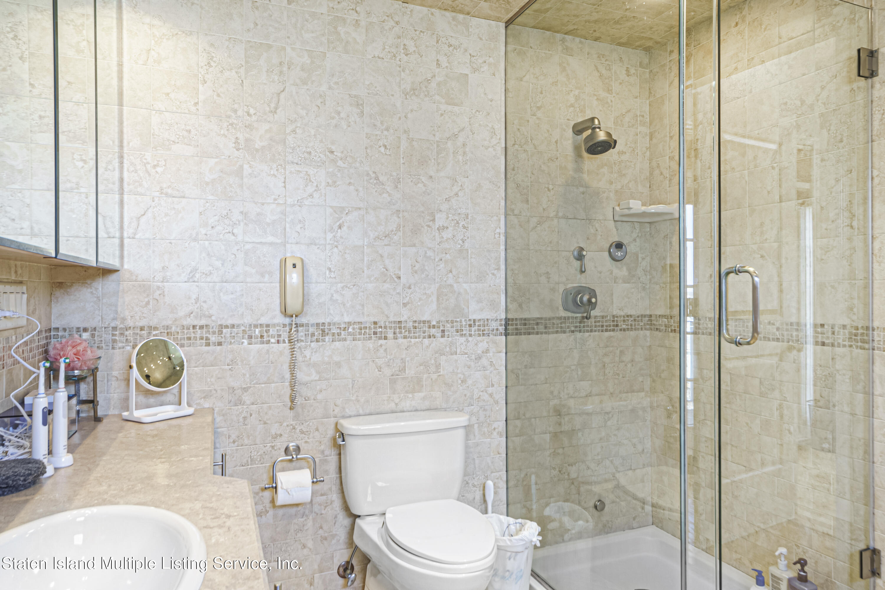 19 Bascom Place Staten Island, NY 10314 - Photo 25 of 54 a bathroom with a toilet and shower